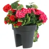 A close-up of a balcony planter box filled with artificial red and pink flowers and green leaves. Produktbild-Vorschau
