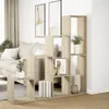 A modern living room with a sofa and a multi-level bookshelf. Produktbild-Vorschau