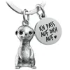 A silver meerkat keychain with a round charm engraved with text. Produktbild-Vorschau