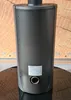 The back view of a black freestanding wood stove. Náhľad obrázku produktu