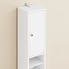 A tall, narrow white cabinet with a single door and a silver knob, mounted on a wall. Náhled obrázku produktu