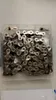 A bicycle chain is neatly arranged in a clear plastic container. Náhľad obrázku produktu