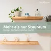 Two wooden shelves are mounted on a white wall, decorated with plants and decorative objects. A green overlay with text is in the middle. Produktbild-Vorschau