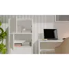 A white cabinet with books and a laptop on a desk. Náhľad obrázku produktu