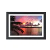 A framed picture of a sunset over the ocean with a palm tree in the foreground. Produktbild-Vorschau