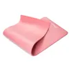 A pink yoga mat is shown folded and isolated on a white background. Náhled obrázku produktu