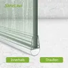 Close-up of a shower door seal with water droplets on the glass, set against a marble-tiled background. Two green buttons labeled 'Innerhalb' (Inside) and 'Draußen' (Outside) are visible at the bottom. Anteprima dell’immagine prodotto