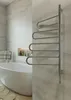 A modern bathroom with a freestanding bathtub and a wall-mounted towel warmer. Podgląd zdjęcia produktu