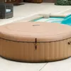 An inflatable hot tub is placed on a patio next to a swimming pool. Náhľad obrázku produktu