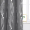 A close-up view of a dark gray curtain with a white wavy line pattern, next to a window with a framed picture. Produktbild-Vorschau
