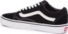 A side view of a black Vans Old Skool sneaker with white accents and laces. Voir les images du produit
