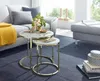 A living room scene with a sofa, coffee tables, and decorative items. Produktbild-Vorschau