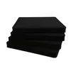A stack of four black cushions on a white background. Produktbild-Vorschau