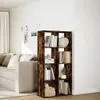 A bookshelf is placed next to a sofa in a living room. Náhled obrázku produktu