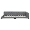 A gray upholstered daybed frame without a mattress, shown from the front, with its wooden slats visible. The frame appears to be in two sections, possibly to allow for conversion or easier transport. Produktbild-Vorschau