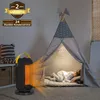 A child sleeps in a teepee while a space heater warms the room. Anteprima dell’immagine prodotto