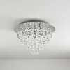A crystal chandelier light fixture is mounted on a white ceiling. Produktbild-Vorschau