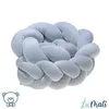 A light blue braided baby nest on a white background. Produktbild-Vorschau