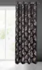 A curtain with a leaf pattern hanging in front of a window. Produktbild-Vorschau
