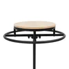 A close-up view of the top of a black metal clothing rack with a round wooden shelf. Podgląd zdjęcia produktu