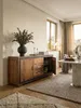 Massives Sheeshamholz Sideboard 160x80cm in einem eleganten Esszimmer. Die Anrichte mit schwarzem Kunstleder-Rahmen bringt warme Holztöne und rustikalen Charme ins moderne Interieur._#sku_BARWL5.193# Produktbild-Vorschau