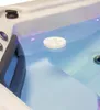 Close-up view of a white floating disc in a hot tub. Produktbild-Vorschau