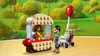 A LEGO scene depicting a park with a hot dog stand, a father and baby in a stroller, and a woman at the stand. Podgląd zdjęcia produktu