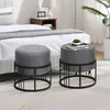 Two upholstered ottomans are placed next to a bed in a bedroom setting. Anteprima dell’immagine prodotto