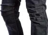 A close-up view of dark wash denim jeans with distinctive ruched detailing on the legs. Podgląd zdjęcia produktu