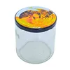 A clear glass jar with a lid featuring a bee design. Náhľad obrázku produktu