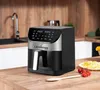 An air fryer is shown on a wooden countertop in a kitchen setting. Náhled obrázku produktu