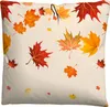 A pillow with a pattern of falling autumn leaves. Produktbild-Vorschau