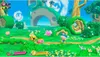 Two characters, Kirby and a yellow character, are in a vibrant green landscape with large, whimsical structures in the background. Produktbild-Vorschau