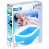 The image shows the packaging for a Vilde brand inflatable swimming pool. The packaging features a lifestyle image of a woman on a pink flamingo float in a pool, with the inflatable pool itself prominently displayed. Produktbild-Vorschau