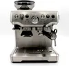 A silver espresso machine with a black portafilter and a transparent bean hopper on top. Produktbild-Vorschau