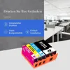 Four ink cartridges in a holder, with a background of an office space. Produktbild-Vorschau