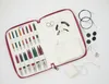 An open knitting needle set case with various knitting needles and accessories laid out on a white background. Produktbild-Vorschau