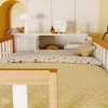 A close-up view of a child's bed with bedding and a shelf unit above it. Anteprima dell’immagine prodotto