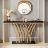 A modern console table with a black marble top and gold metal legs, displayed in a well-lit room with decorative items. Produktbild-Vorschau