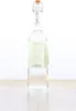 A clear studio shot of a bottle of liquor on a wooden surface. Produktbild-Vorschau
