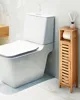 A modern bathroom setting with a white toilet and a narrow wooden storage cabinet next to it. Podgląd zdjęcia produktu