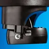 A close-up view of the bottom part of a black electronic device, showing a microSD card slot and a screw. Produktbild-Vorschau