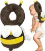 A baby wearing a bee-themed safety backpack for learning to walk. Podgląd zdjęcia produktu