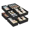 A set of black fabric drawer organizers filled with folded clothing items like socks, underwear, and ties. Produktbild-Vorschau