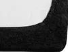 A close-up view of the corner of a black fitted sheet, showing the texture of the fabric and the elasticated edge. Náhled obrázku produktu