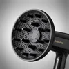 Close-up of a black hair dryer with a diffuser attachment. Anteprima dell’immagine prodotto