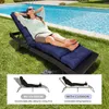 A woman relaxing on a cushioned lounge chair next to a swimming pool. Náhled obrázku produktu