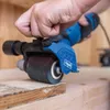 A person is using a Scheppach satiniermaschine (sanding machine) on a wooden surface. Produktbild-Vorschau