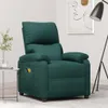 A dark green fabric massage chair is shown in a room with a floor lamp and a small table with a plant. Náhľad obrázku produktu