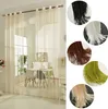 A room divider curtain made of strings in a room with furniture. Produktbild-Vorschau